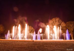 Atlantid - Photo of flames with fountain show and purple jets